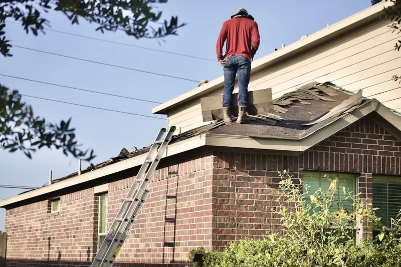 Professional roofer working on a residential roof in Washington Grove